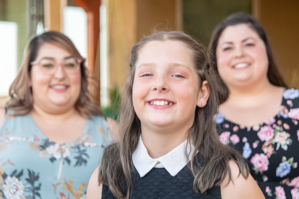 Two mums with their daughter