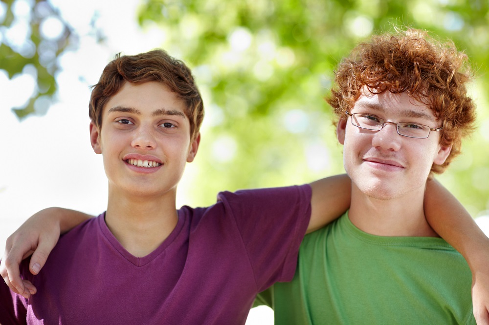 Two teenage friends smiling