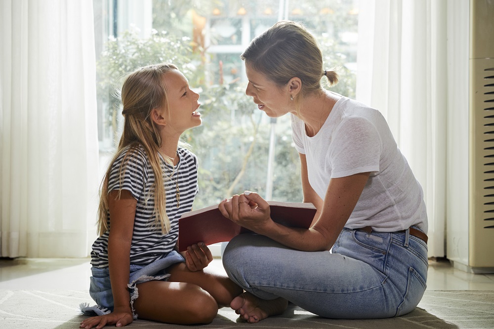 Mum talking to young girl