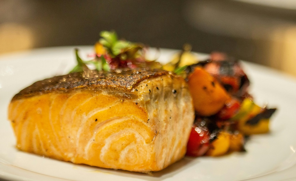 Baked salmon with glazed root vegetables