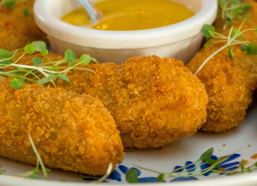 Breaded fish with a mustard dip