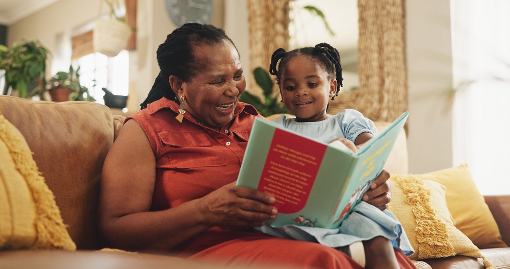 Grandma reading with her granddaughter