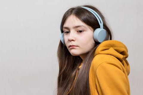 Teen girl wearing headphones